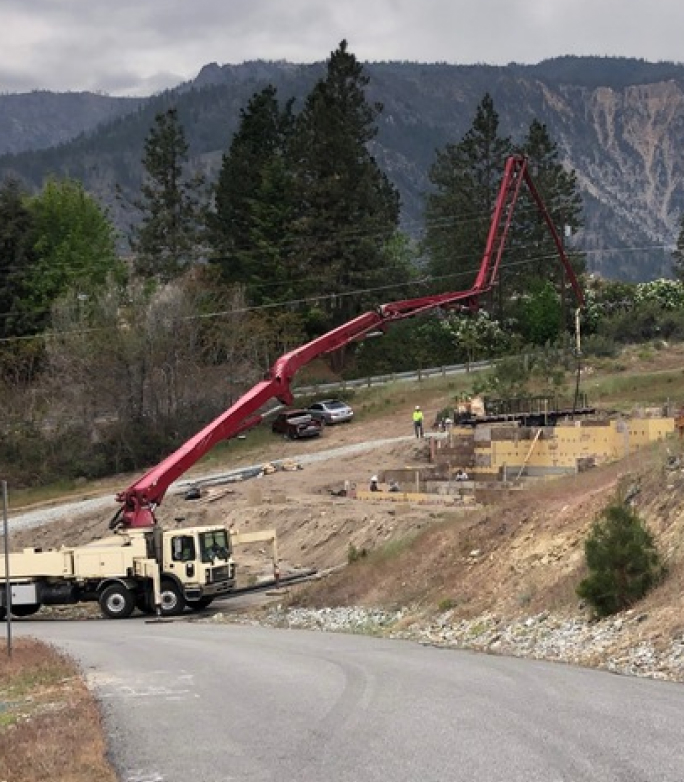 Concrete pump pouring concrete on a slope in Central Washington